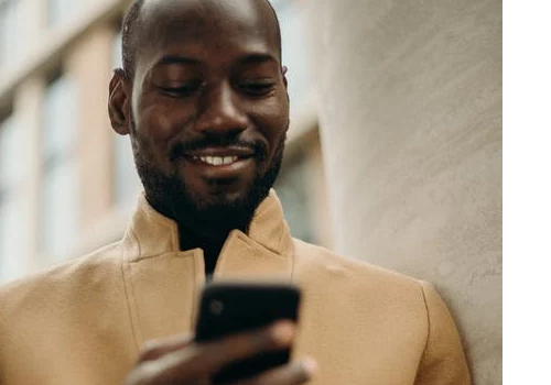 Black man looking at phone