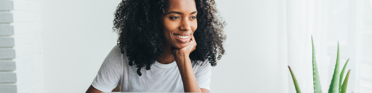 black woman indoors casual, smiling