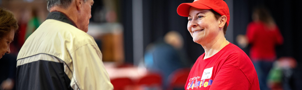 cheerful woman volunteer at Cornell employee event