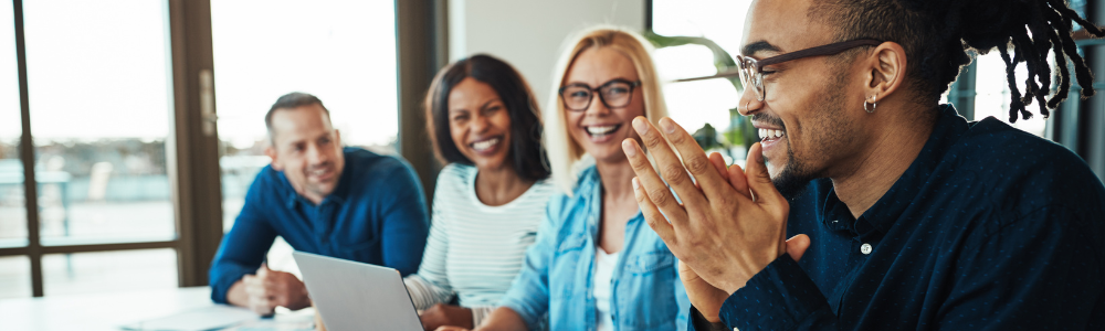 diverse group of employees interacting, smiling