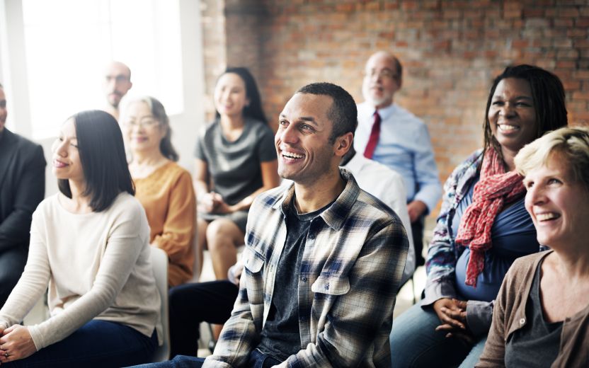 man smiling in group training