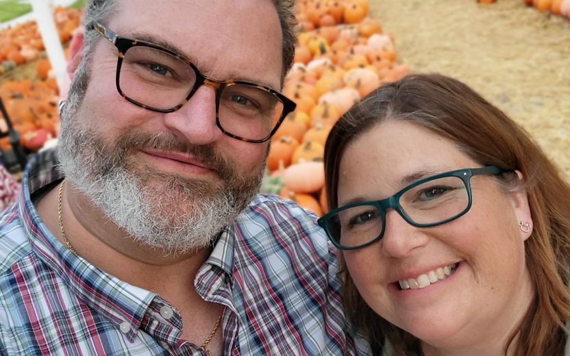 Suzanne & Woodg Horning posing outdoors at pumpkin farm