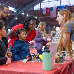 family at activity table at Employee Celebration