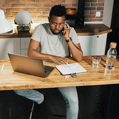 Man sitting at stylish desk at home