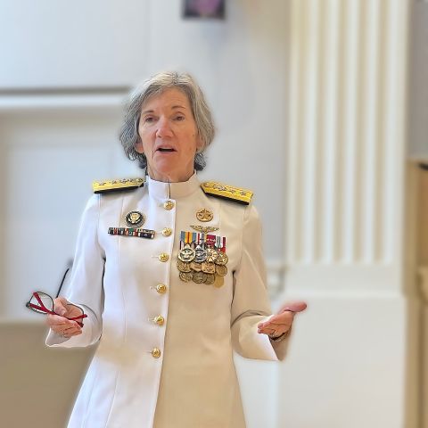 female admiral in uniform speaking