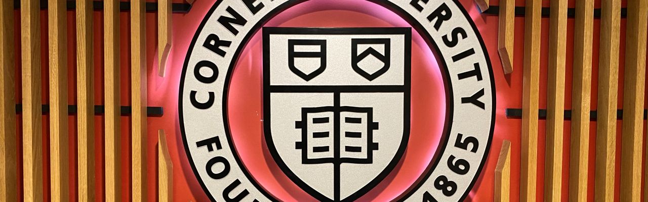 Cornell seal on wall in Willard Straight Hall