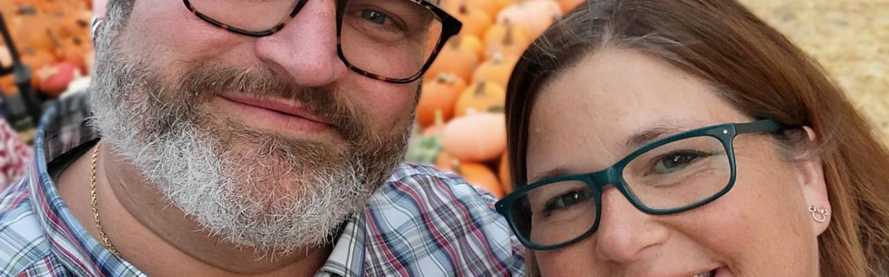 Suzanne & Woodg Horning posing outdoors at pumpkin farm